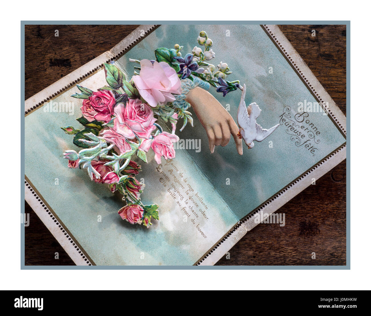 Ergreifende Vintage historischen 1915 "pop-up" floral Vogel des Friedens Postkarte von der WW1-Front in Frankreich, von einem britischen Soldaten wollen seine geliebten "Good and Happy Party" Stockfoto