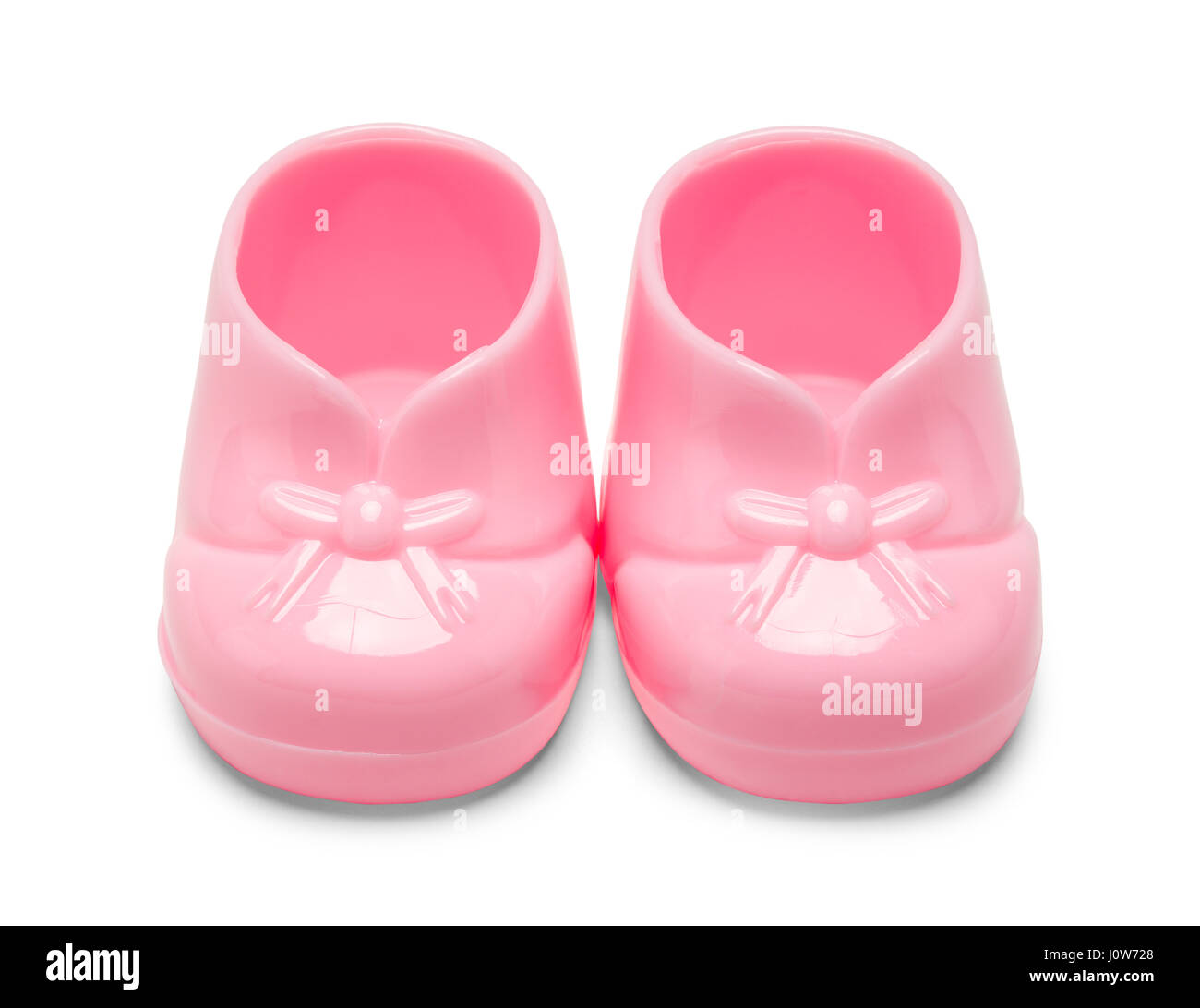 Zwei rosa Kunststoff Baby-Schuhe, Isolated on White Background. Stockfoto