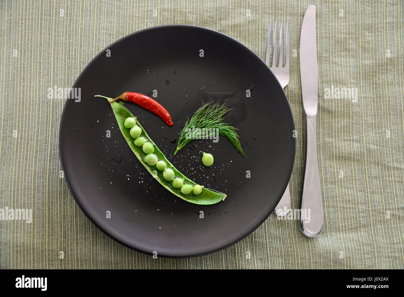 PEA Pod mit Chili und dill Stockfoto
