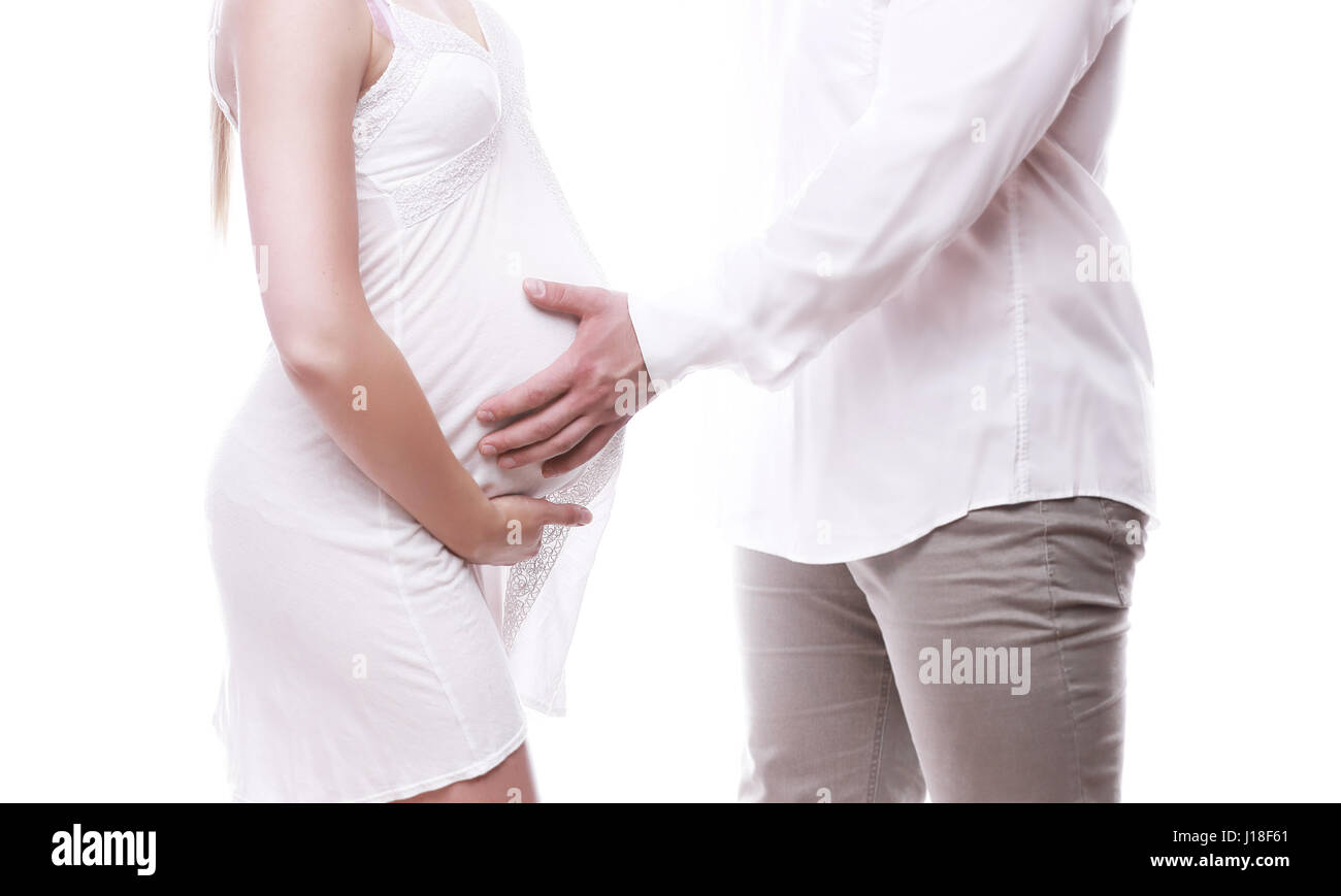 Schöne junge Paar erwartet Baby auf weißem Hintergrund Stockfoto