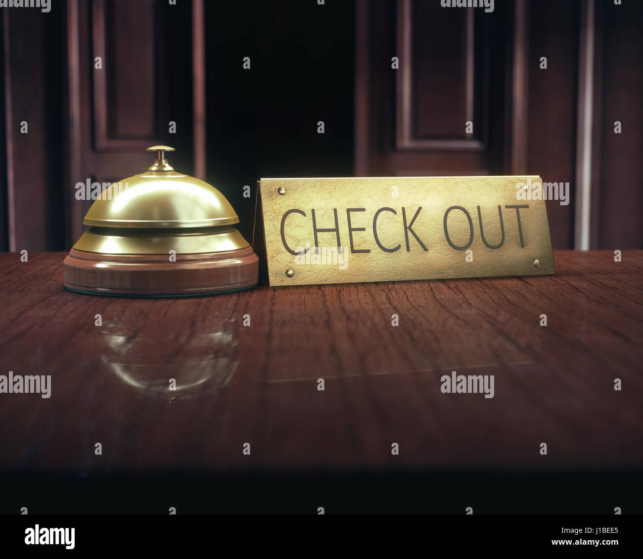 Vintage Glocke mit "check out" Meldung auf dem hölzernen Schreibtisch von der Lobbyservice. Stockfoto