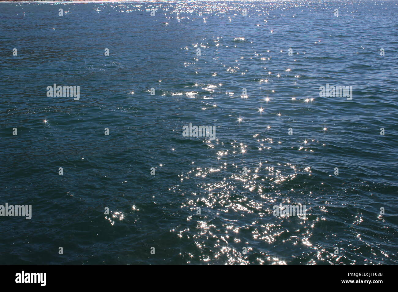 Sonnenlicht auf dem Wasser, Kalk Bay Harbour, Kapstadt, Südafrika Stockfoto