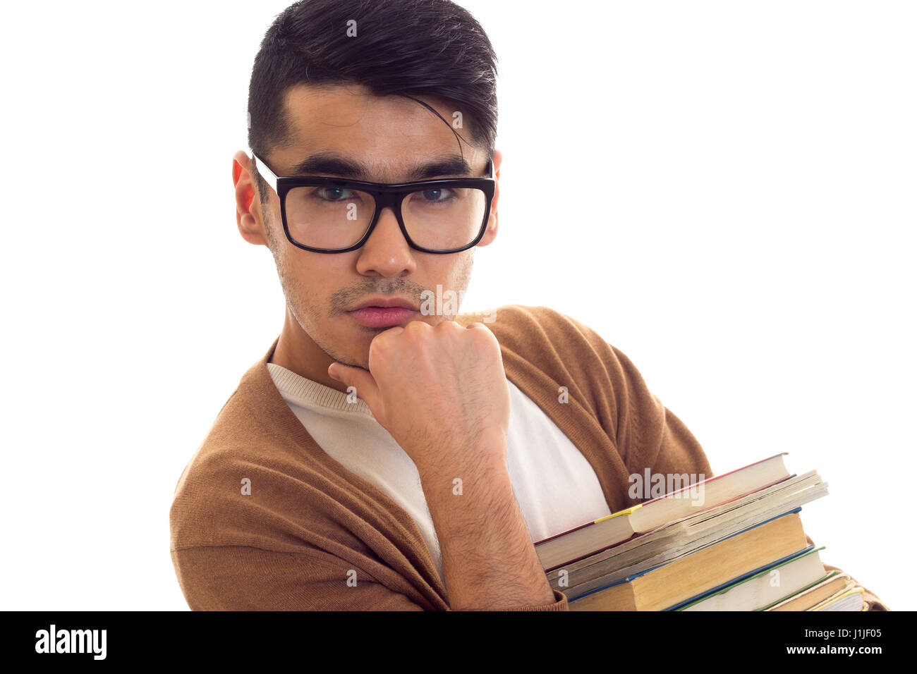Junger Mann in Gläsern mit Büchern Stockfoto