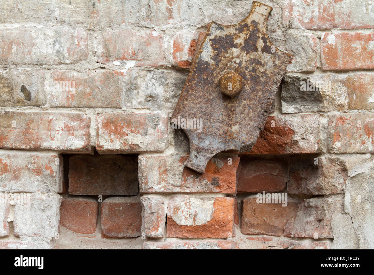 Vintage-Hintergrund Textur alten Mauerwerk Stein Ziegel auf dem alten Zement mit Rissen Stockfoto