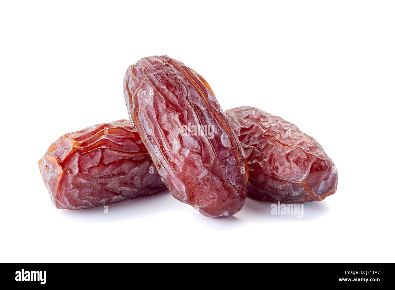 Drei getrocknete Datum-Frucht auf weiß Stockfoto