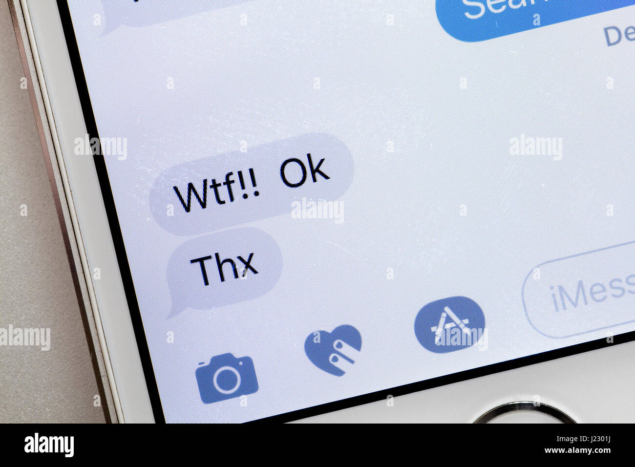 Sms-Nachricht auf dem Bildschirm des iPhone (WTF Text, Thx Text) - USA Stockfoto