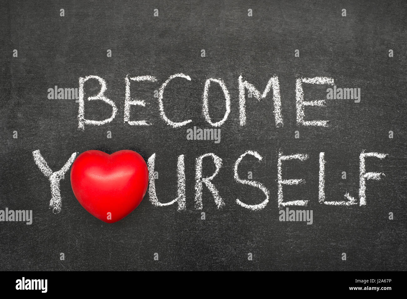 werden Sie selbst zum handschriftlich Ausdruck auf Tafel mit Herzsymbol stattdessen O Stockfoto