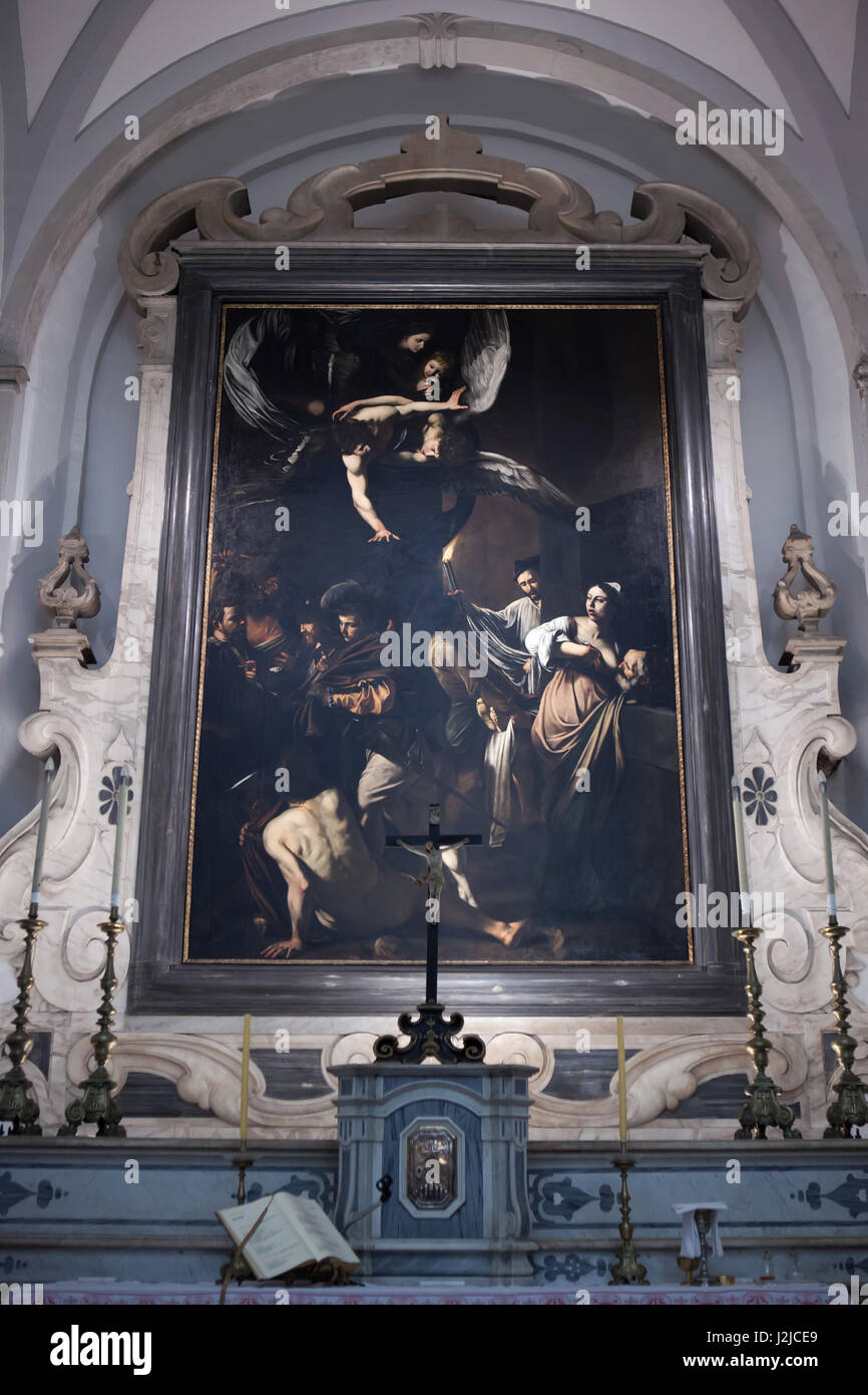 Gemälde "Die sieben Werke der Barmherzigkeit" italienischen Barock-Malers Caravaggio (1606-1607) angezeigt, in dem Hochaltar in der Kirche von Pio Monte della Misericordia in Neapel, Kampanien, Italien. Stockfoto