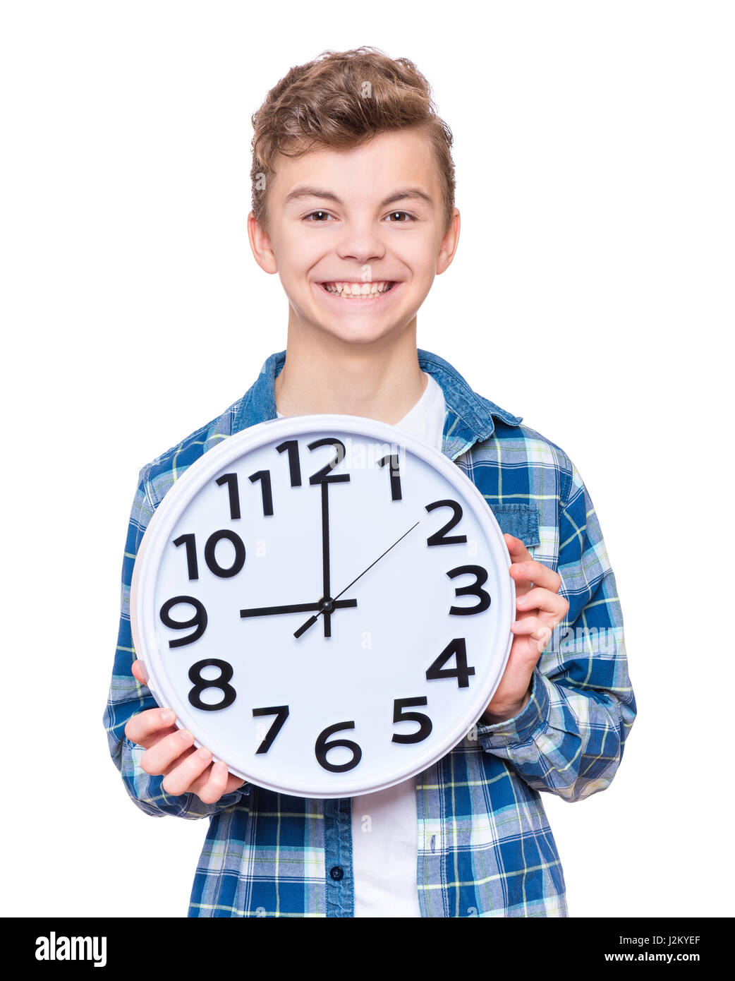 Teenboy mit grossen Uhr Stockfoto