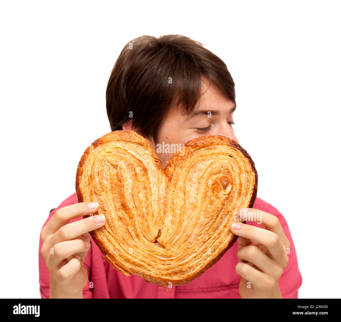 Teenager, Essen, essen riesige Palmerita cookie Stockfoto
