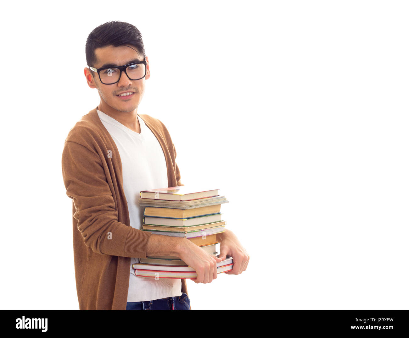 Junger Mann in Gläsern mit Büchern Stockfoto