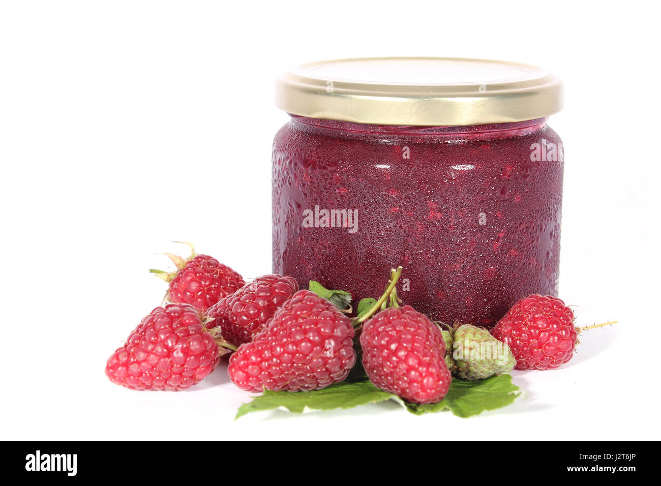 Glas mit Himbeermarmelade und frischen Früchten Stockfoto