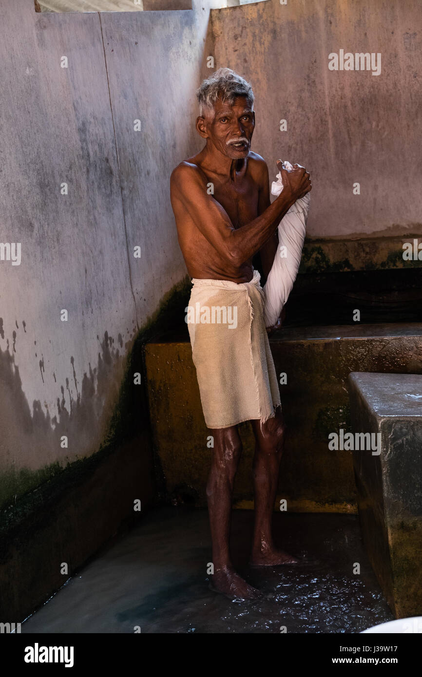 Dhobi Waschmaschinen/Wäscheservice Arbeitnehmer in Cochin ist Waschhaus Stockfoto