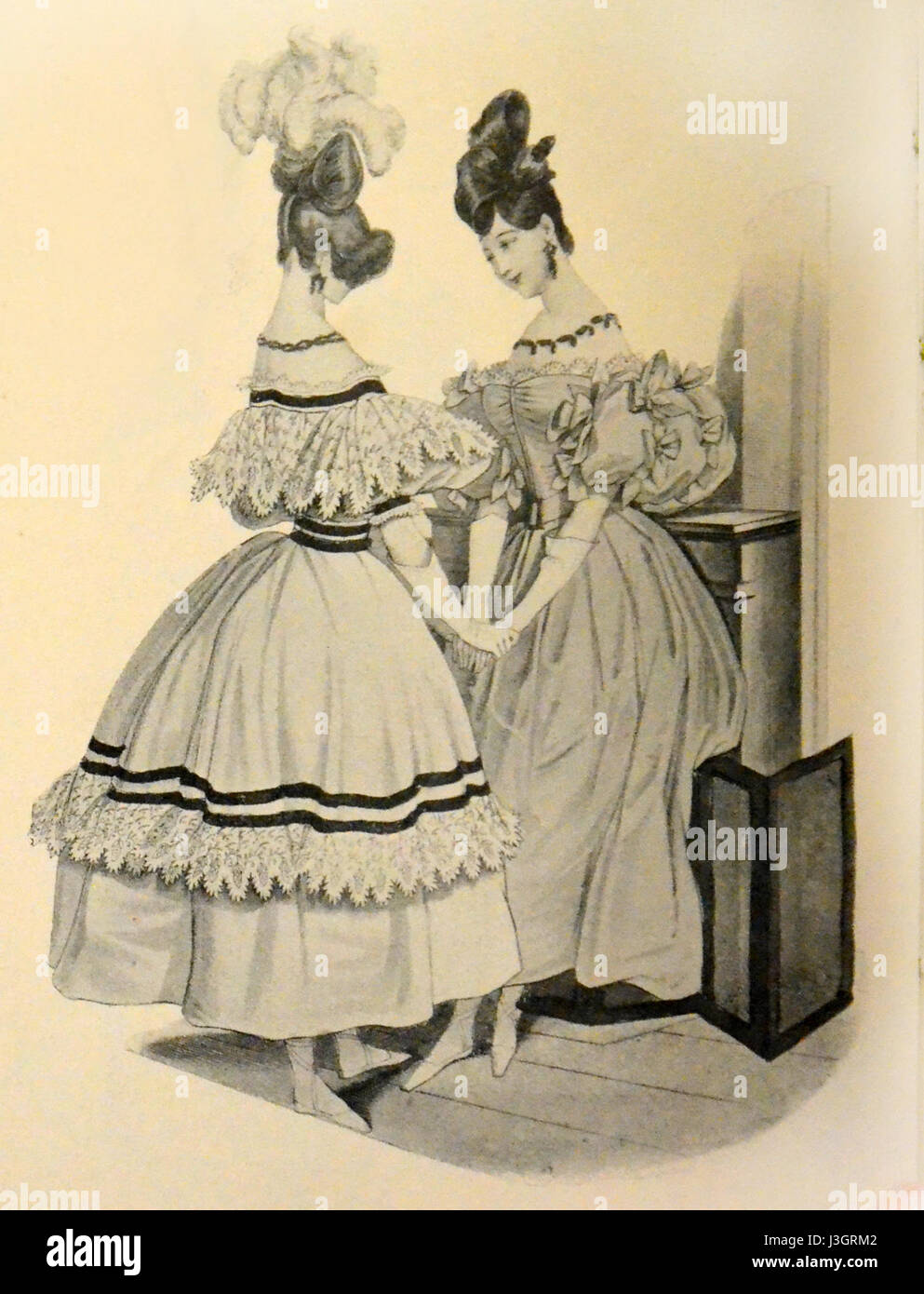 Diese Modebücher von Gavarni, die zwischen 1830 und 1835 entstanden sind, zeigen französische Haute Couture und die Sartorial Stile des 19. Jahrhunderts. Stockfoto