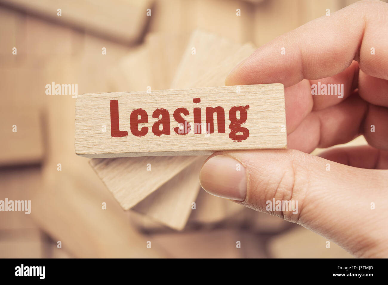 Leasing auf Holzstück, Business-Konzept Stockfoto