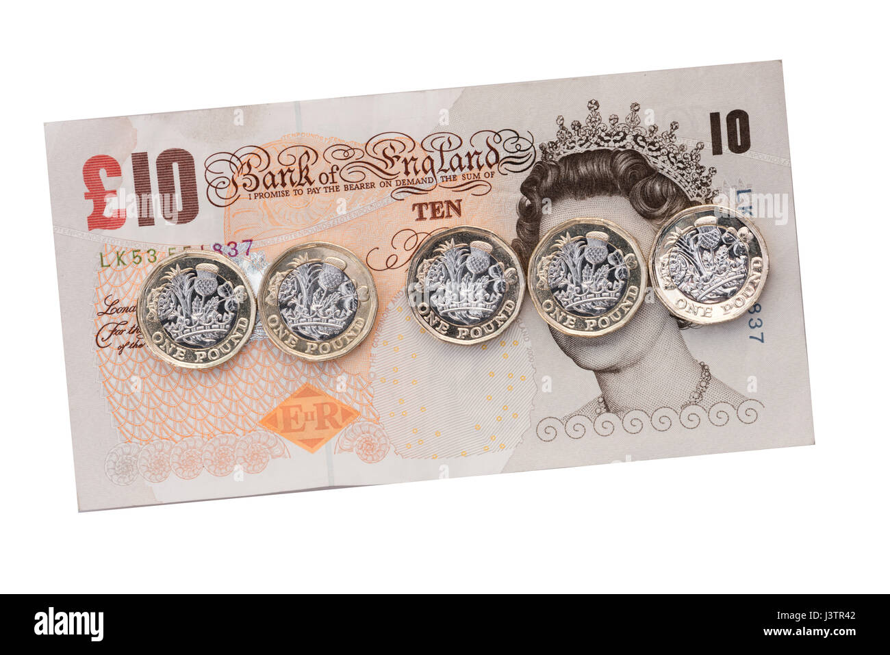Neue Pfund-Münzen über einen £10-Pfund-Note, UK. Stockfoto