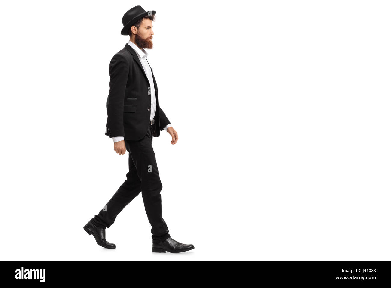 Voller Länge Profil Schuss eines eleganten Mannes zu Fuß isolierten auf weißen Hintergrund Stockfoto