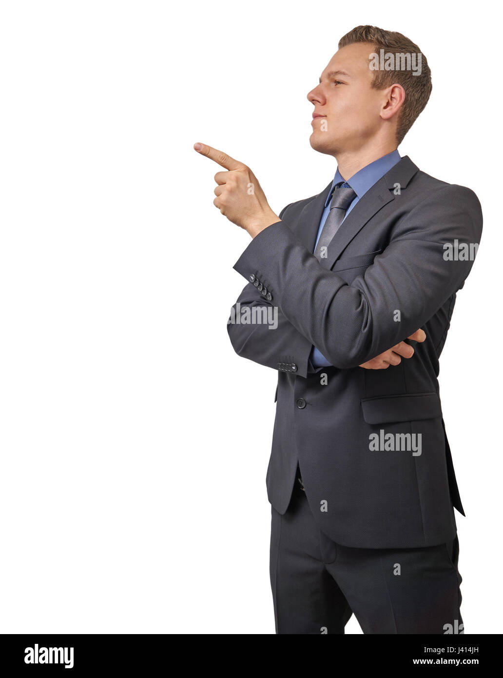 Junger Geschäftsmann Punkte mit dem Finger auf seinem Recht - mit Exemplar isoliert. Skeptisch, kritisch oder Analyse Ausdruck für Werbung. Stockfoto