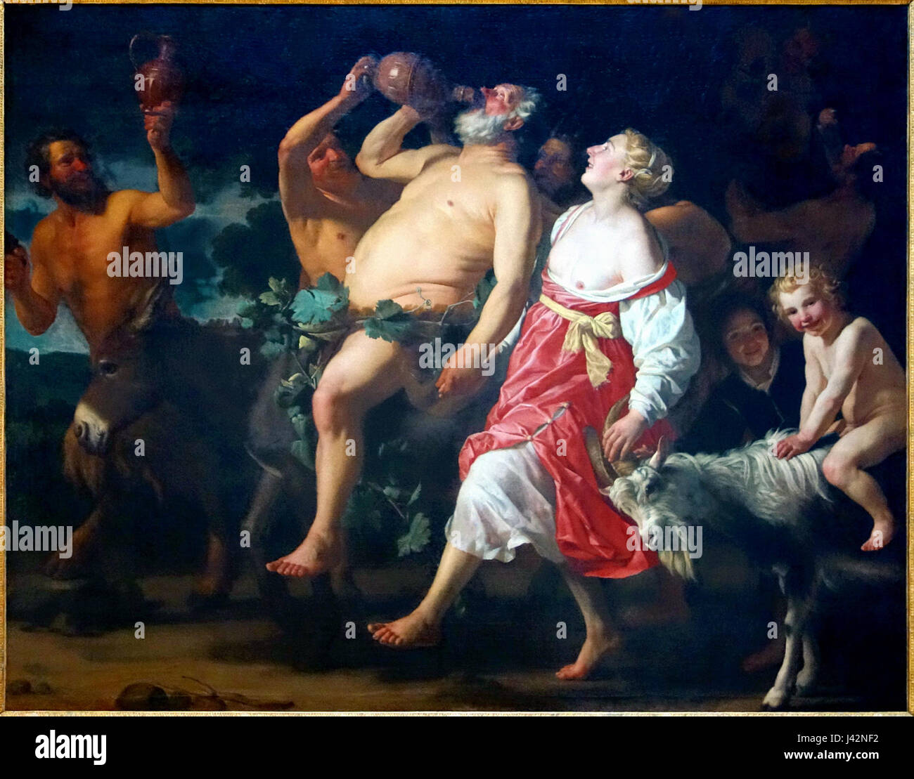 Le Triomphe de Silène ist ein Ölgemälde von Gerrit van Honthorst aus den Jahren 1623 bis 1630, das derzeit im Palais des Beaux-Arts de Lille untergebracht ist. Das Kunstwerk zeigt eine lebhafte Prozession von Männern, Frauen und hybriden Kreaturen, die Wein und Rauschen in einer mythologischen Umgebung zelebrieren. Stockfoto