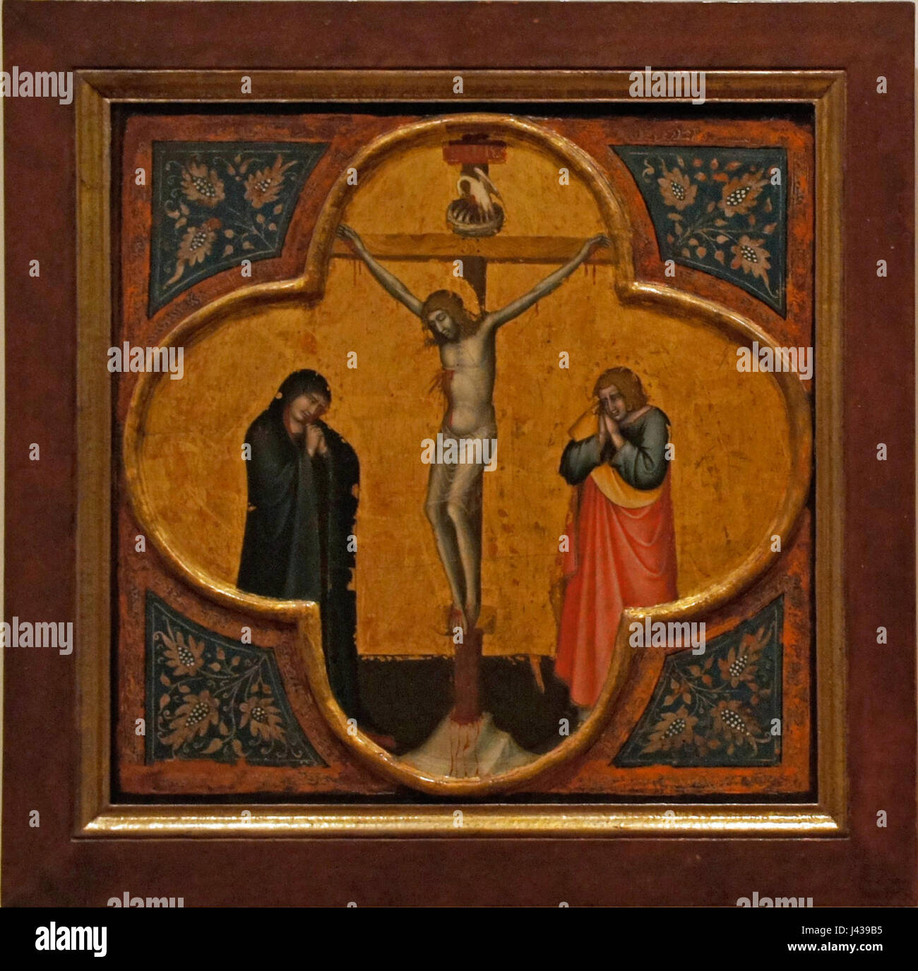 Dieses Kunstwerk, Mello da Gubbioâ™s „Kreuzigung“, zeigt eine Darstellung der Kreuzigungsszene und hebt die emotionale und spirituelle Intensität hervor, die mit diesem christlichen Thema verbunden ist. Das Werk betont die traditionelle religiöse Kunst aus der Renaissance. Stockfoto