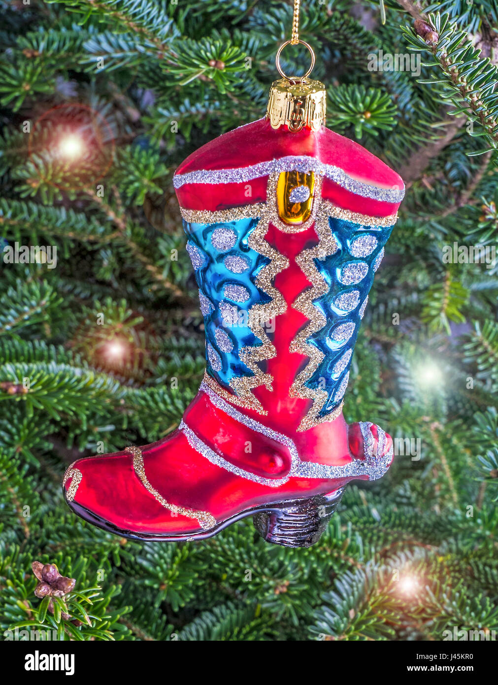 Weihnachtskugel hängen von einem Baum in der Form einer Cowboy-Stiefel Stockfoto