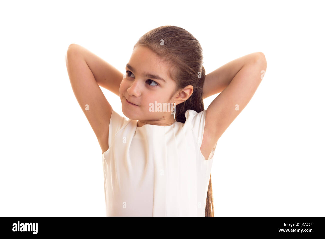 Kleines Mädchen im weißen T-shirt und schwarzer Rock Stockfoto