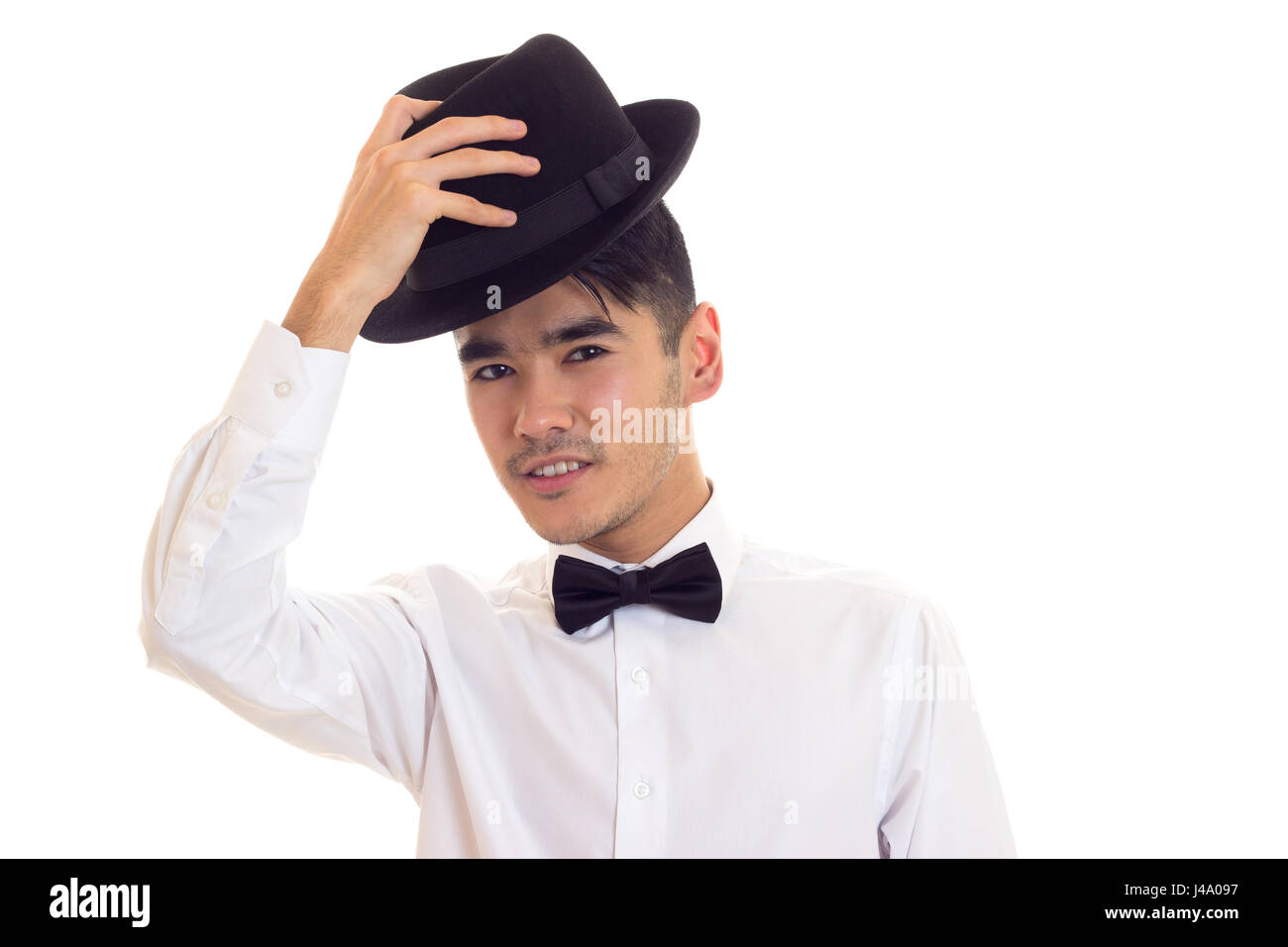 Junger Mann im weißen T-shirt mit schwarzen Hut Stockfoto