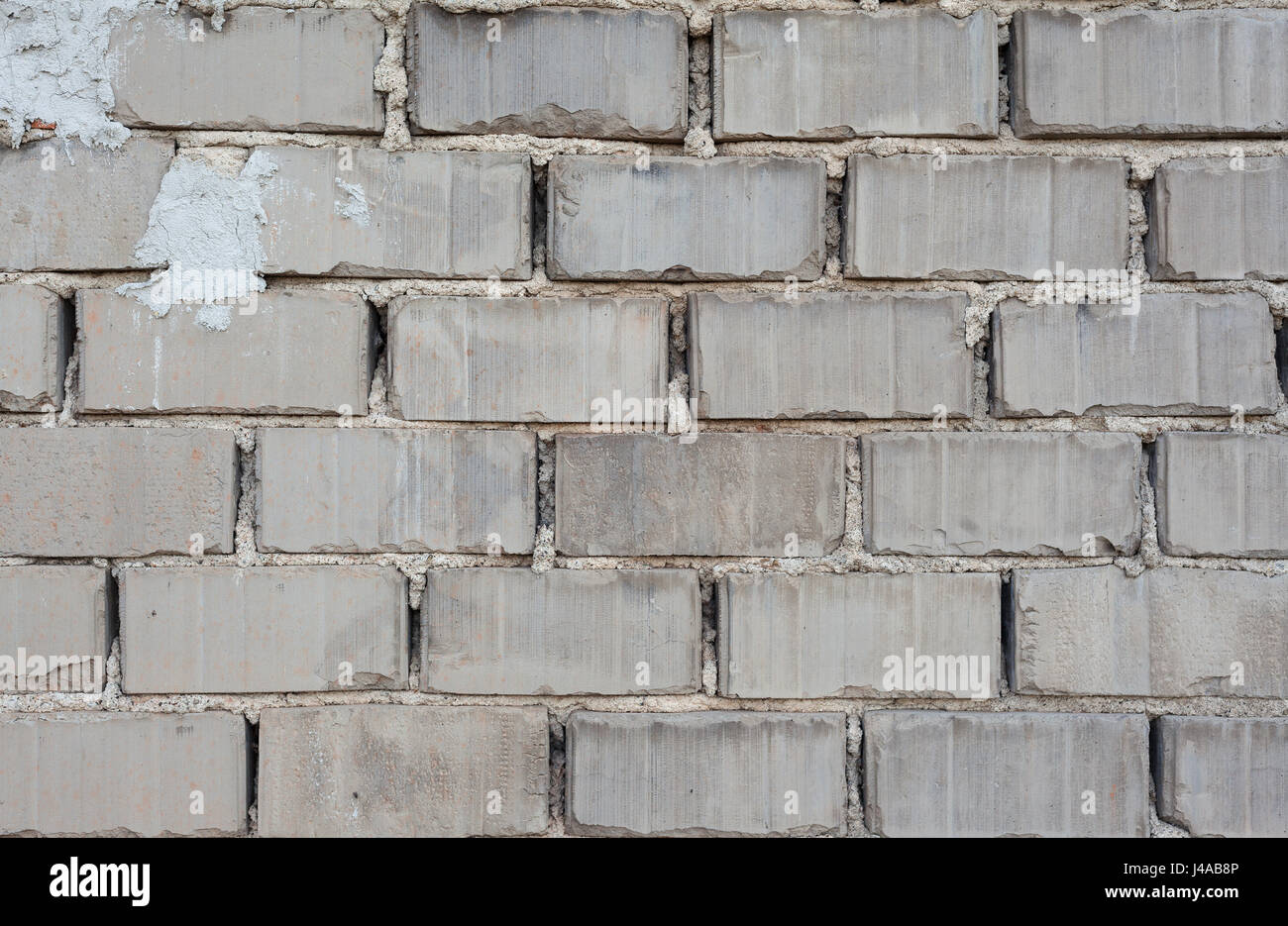 Texturdetails einer Wand aus grauem Beton Ziegel. Stockfoto