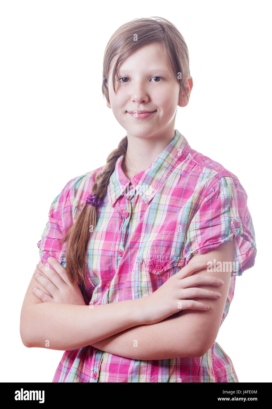 lächelnde junge attraktive Mädchen posiert mit die Arme gekreuzt Stockfoto
