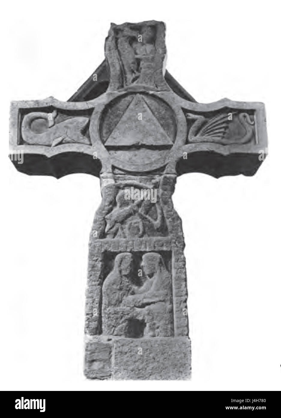 Das Ruthwell Cross ist ein bedeutendes angelsächsisches Steinkreuz in Schottland. Die Südwand zeigt komplizierte Schnitzereien, die Szenen aus der Bibel darstellen, was einen seltenen Einblick in die frühchristliche Kunst in Großbritannien gewährt. Dieses historische Denkmal stammt aus dem 8. Jahrhundert und ist ein Schlüsselstück mittelalterlichen religiösen Erbes. Stockfoto