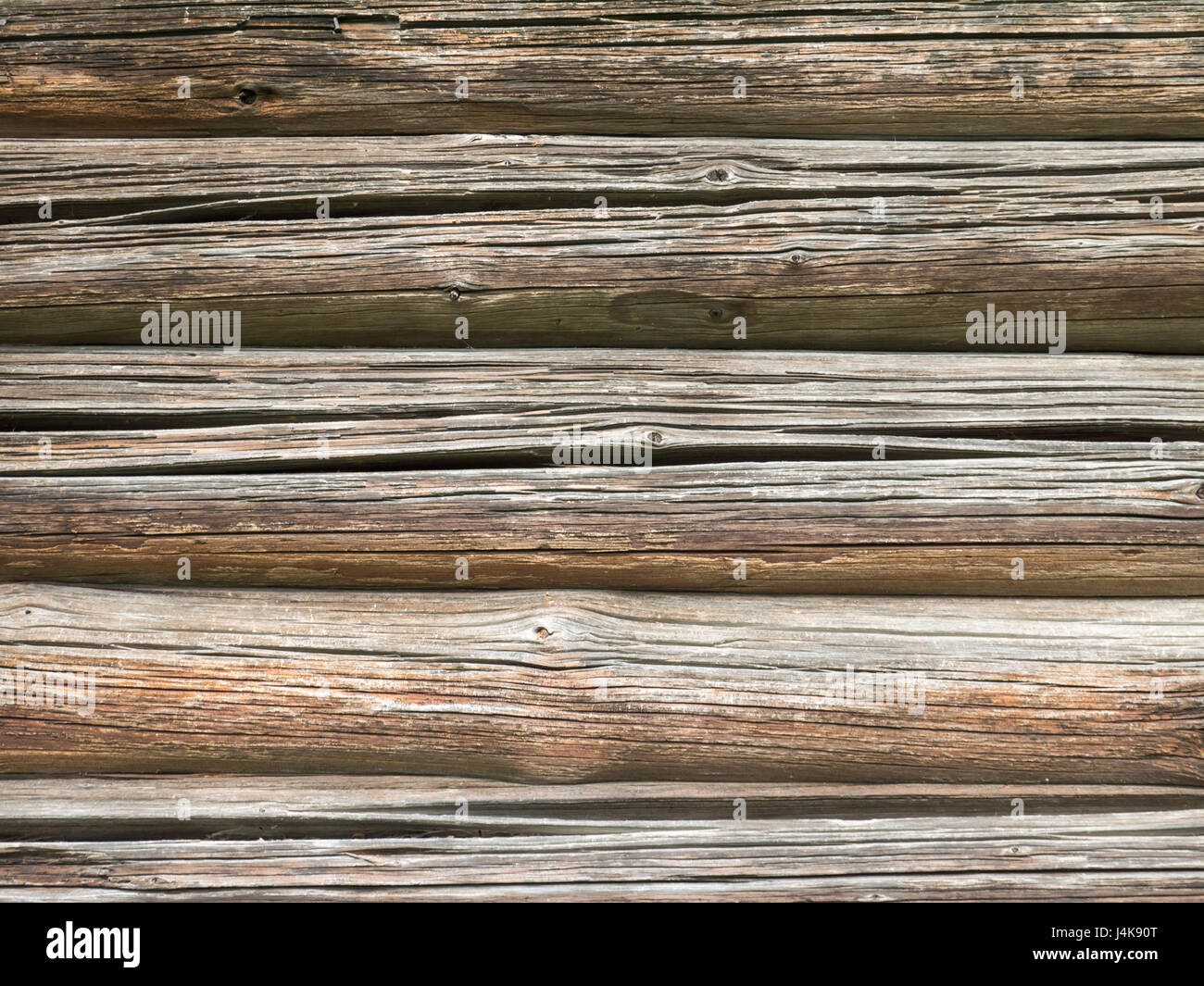 Alte hölzerne verwitterte Holz Kabinenwand mit Rissen Hintergrund Stockfoto