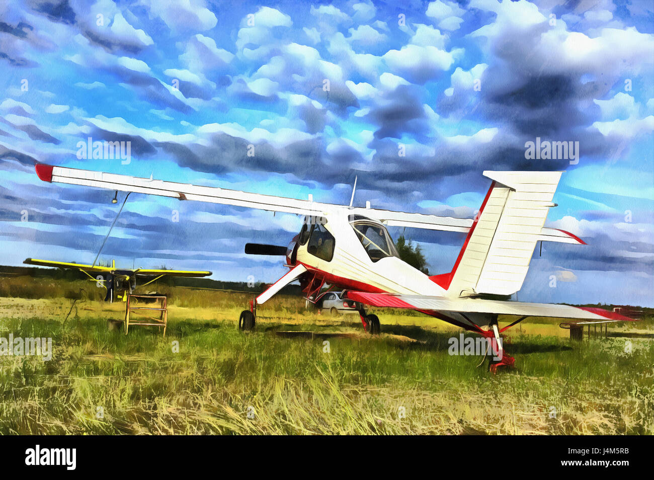 Bunte Gemälde von Leichtflugzeugen Flugzeuge geparkt an einem Rasen-Flugplatz Stockfoto