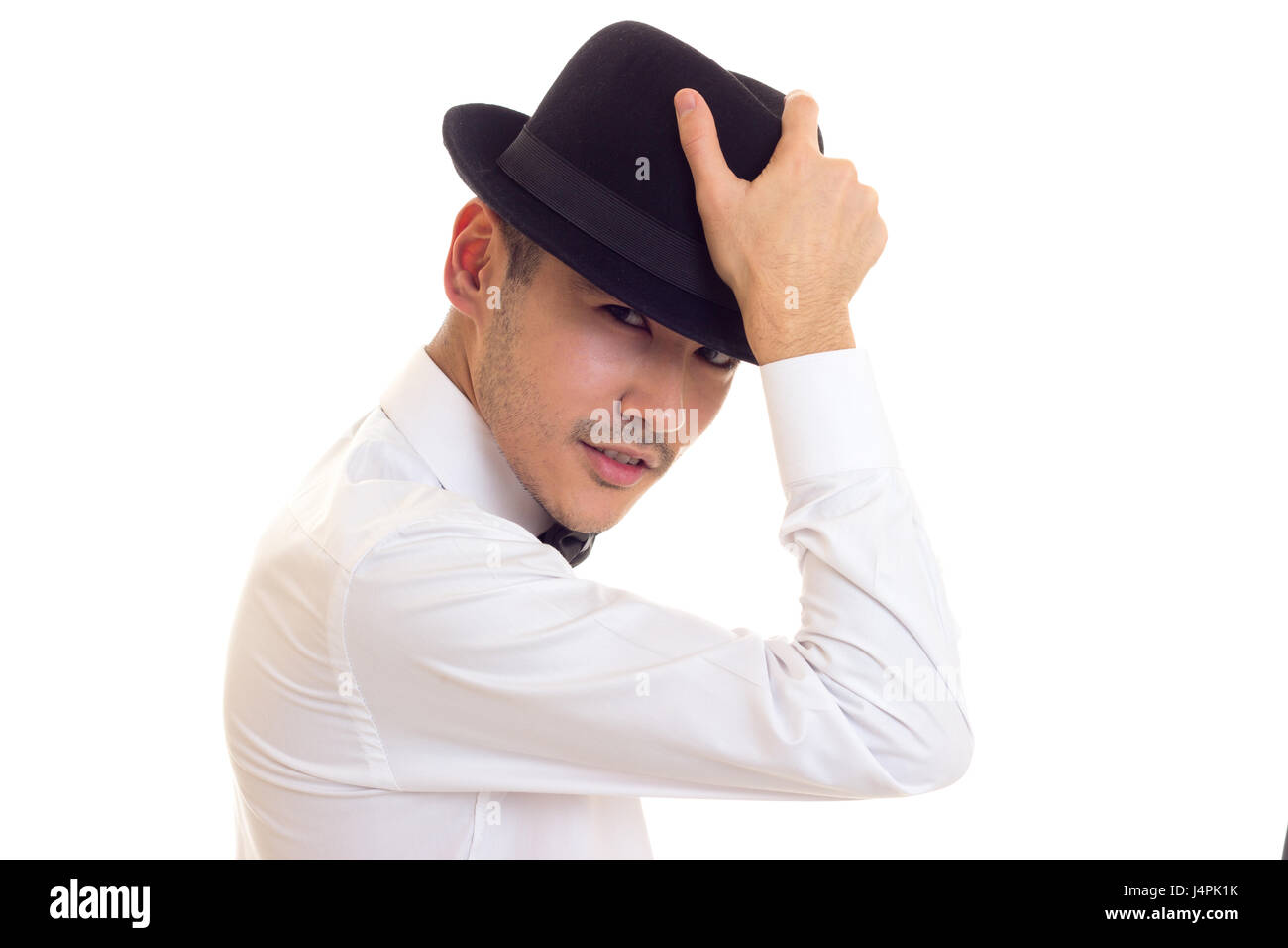 Junger Mann im weißen T-shirt mit schwarzen Hut Stockfoto