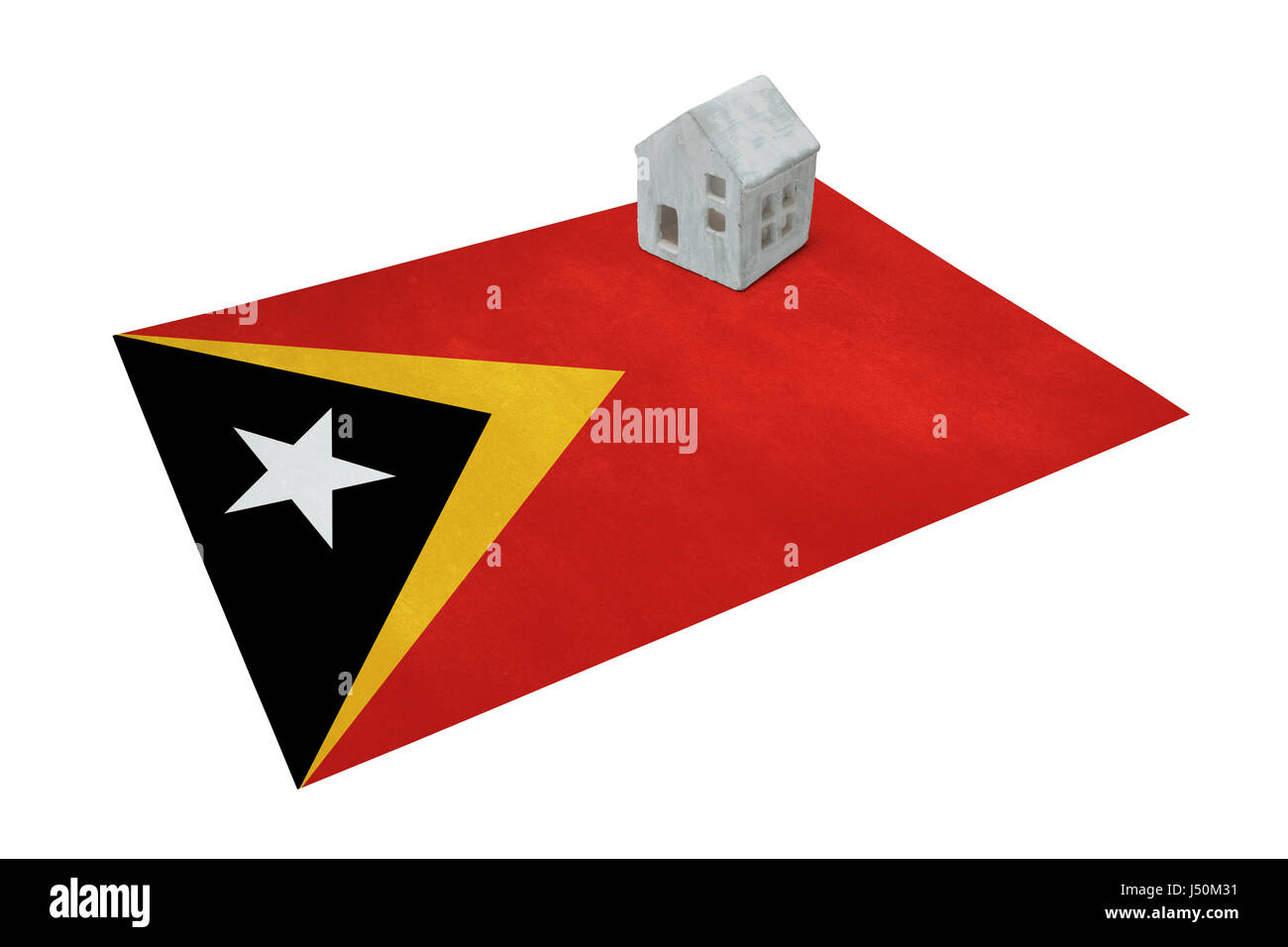 Kleines Haus auf eine Flagge - lebende oder migrieren nach Ost-Timor Stockfoto