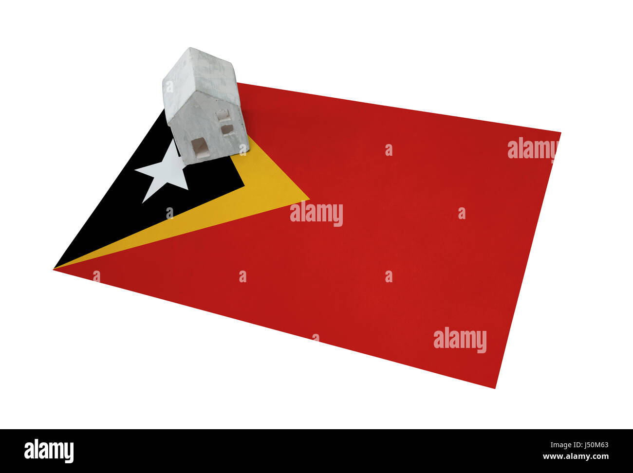 Kleines Haus auf eine Flagge - lebende oder migrieren nach Ost-Timor Stockfoto