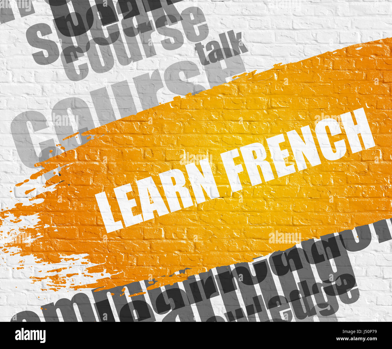 Lernen Sie Französisch auf der weißen Mauer. Stockfoto