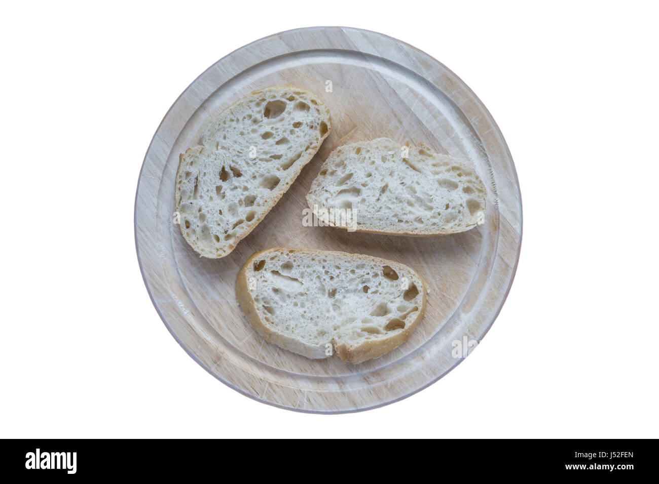 Sauerteig-Brot-Scheiben auf einem Brot-Brett Stockfoto