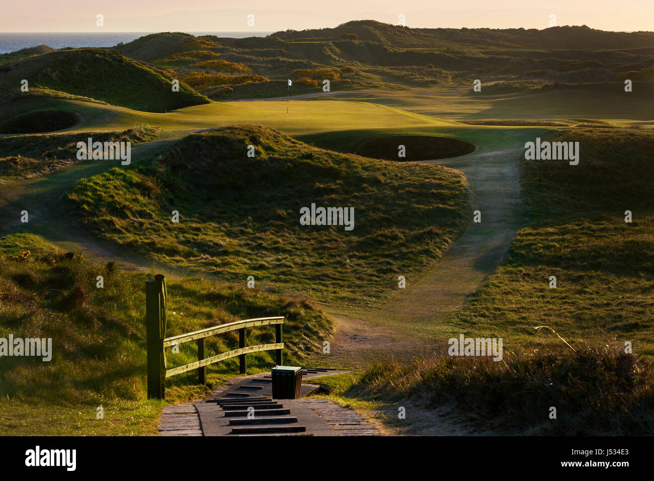 Sonnenuntergang über dem legendären Putting Green auf 8., Briefmarke, Royal Troon Golf Course, Troon, Ayrshire, Schottland Stockfoto