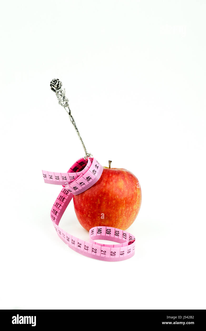 Apfel mit Messung der Band und Silber Gabel Stockfoto