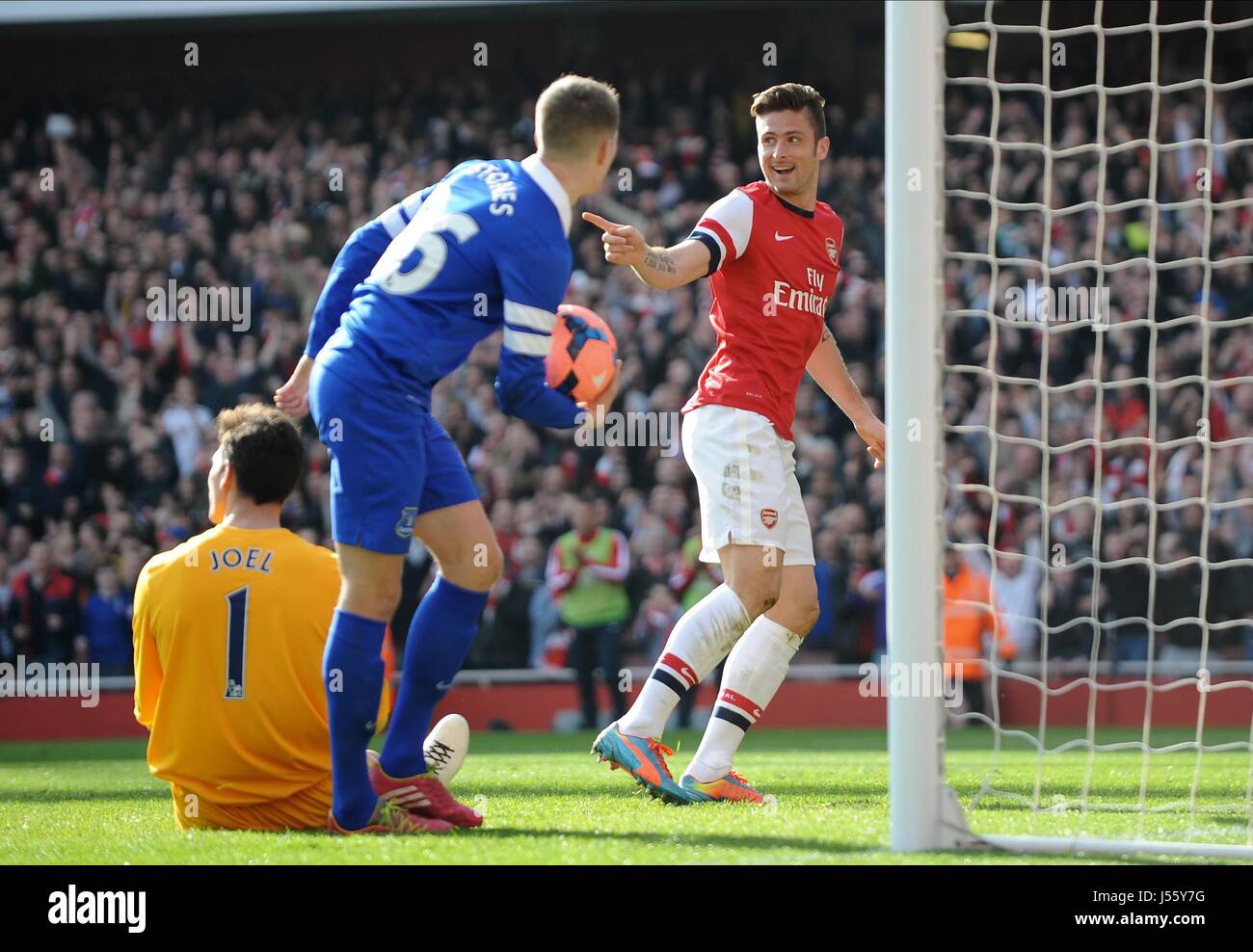 OLIVIER GIROUD Partituren ARSENAL FC V EVERTON FC EMIRATES Stadion LONDON ENGLAND 8. März 2014 Stockfoto