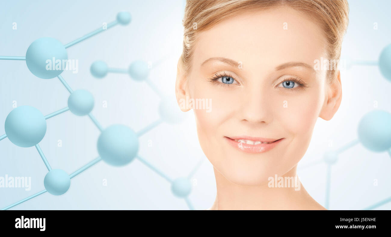 schöne junge Frau Gesicht mit Molekülen Stockfoto