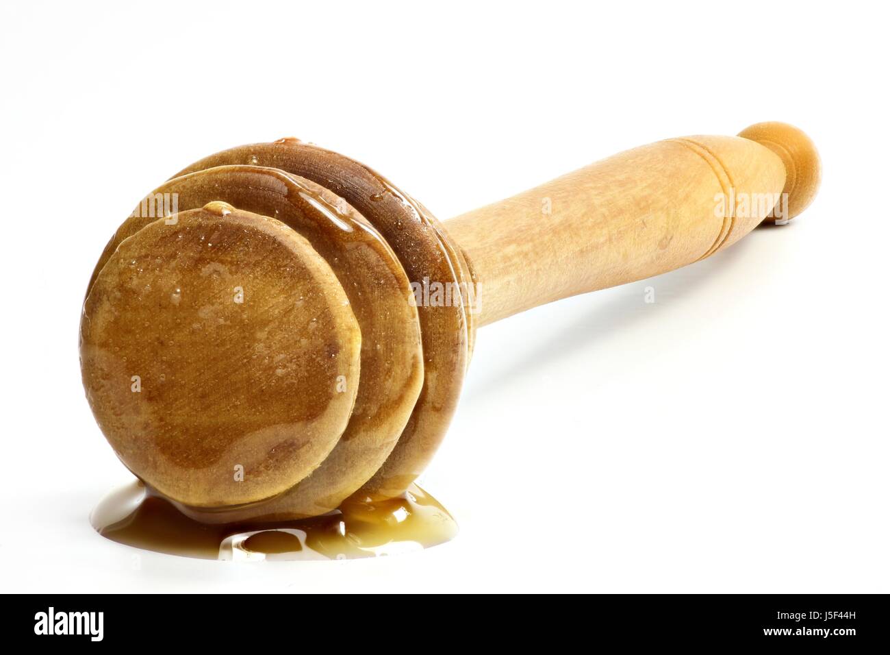 Honig-Löffel gemacht von Olivenholz isoliert auf weißem Hintergrund Stockfoto