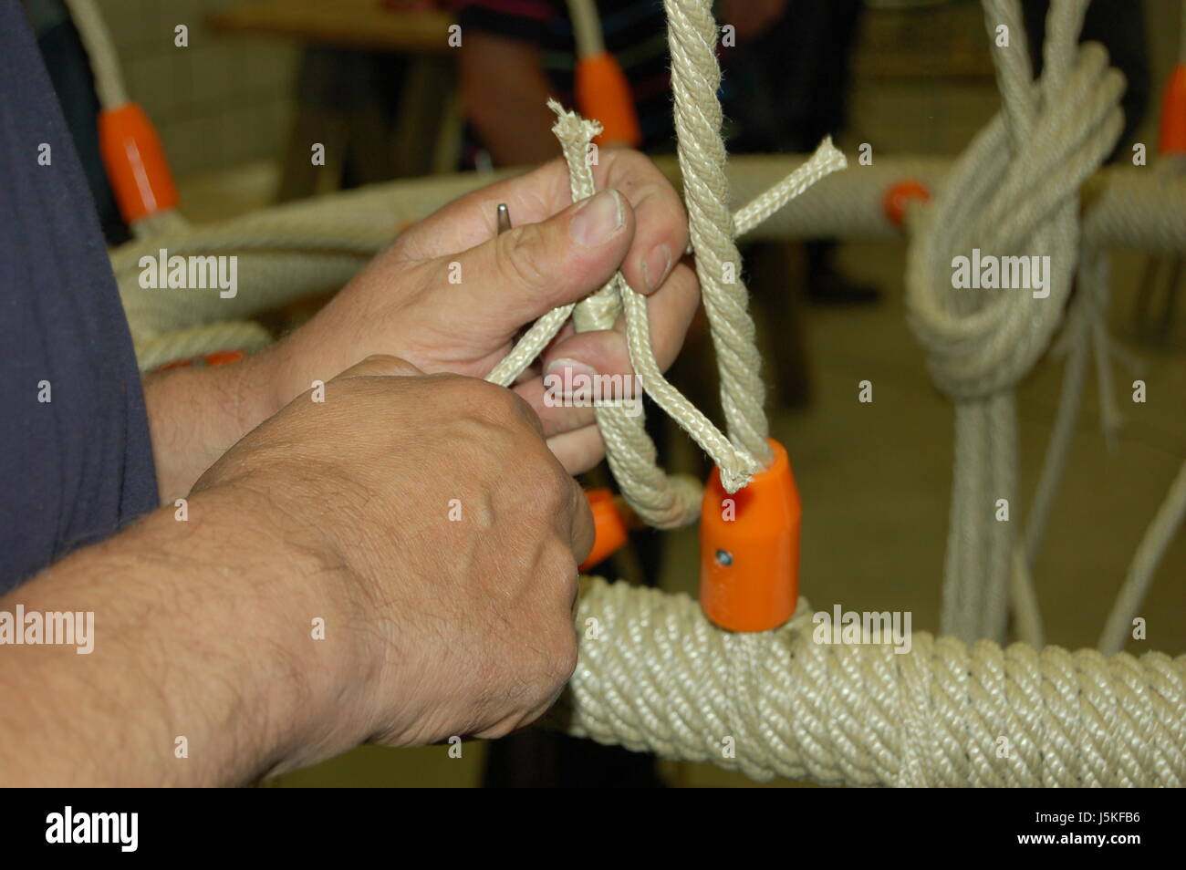 Zopf flechten geflochten geflochtene Handwerk Krawatte schwere Arbeit Seil drehturm Stockfoto