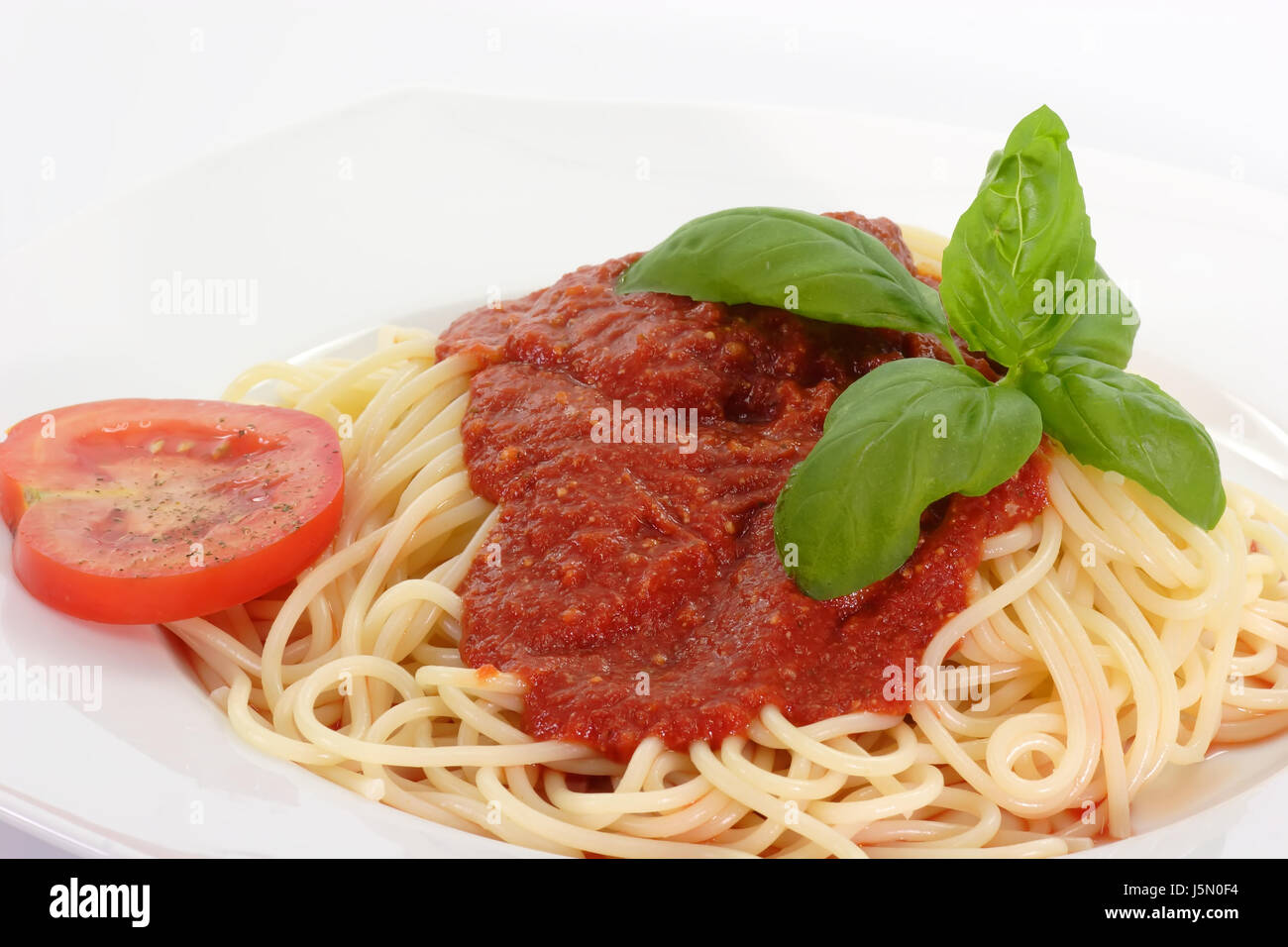 Lebensmittel Nahrungsmittel zierliche Teig Nudeln gekocht Basilikum Spaghetti vegetarisch appetitlich Stockfoto Lebensmittel Nahrungsmittel zierliche Teig Nudeln gekocht Basilikum Spaghetti vegetarisch appetitlich Stockfoto