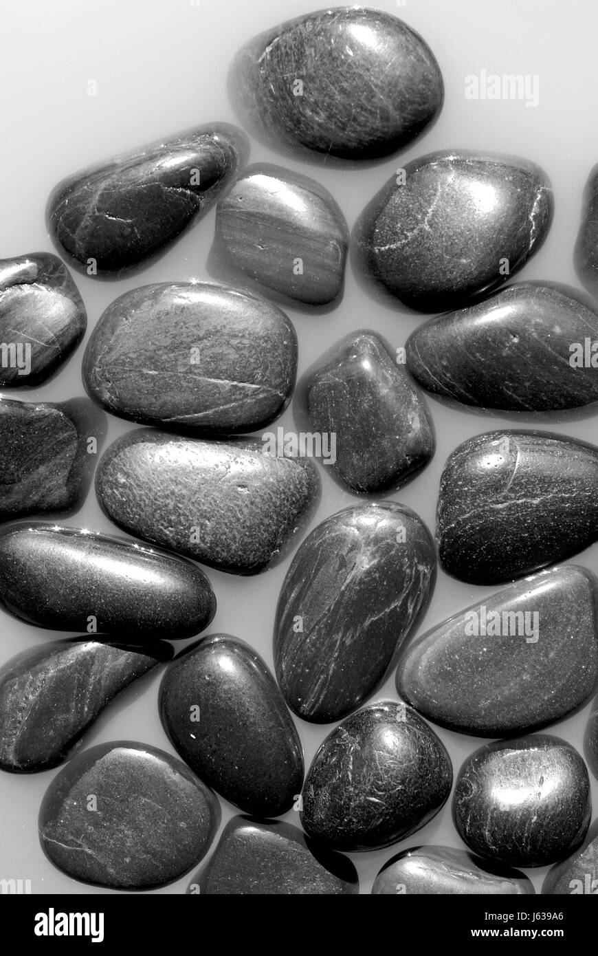 Stein schwarz dunkelhäutigen kohlschwarze tiefschwarze Deko abstrakt glatten Hintergrund Stockfoto
