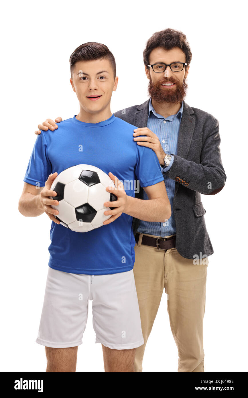 Teenager Fußballspieler posiert mit seinem Vater isoliert auf weißem Hintergrund Stockfoto