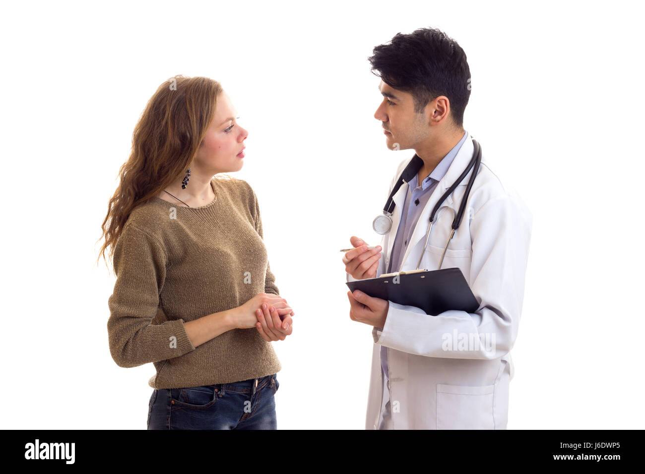 Männlichen Arzt im Gespräch mit junge Frau Stockfoto
