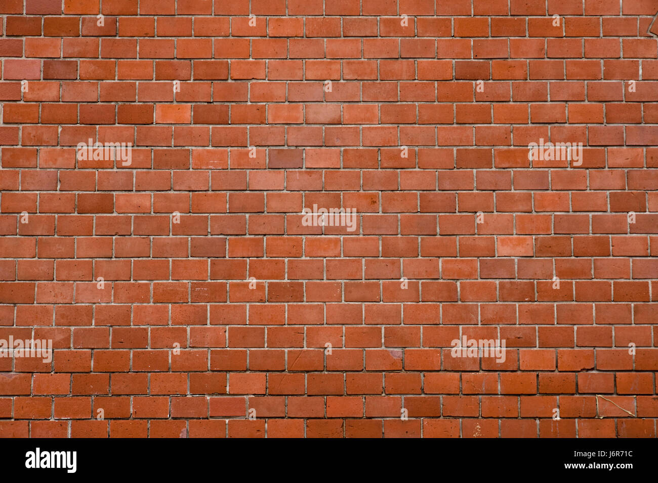 Haus Gebäude Wand Zementklinker gemauerten Steinen bauen Oberflächenstrukturen orange Stockfoto