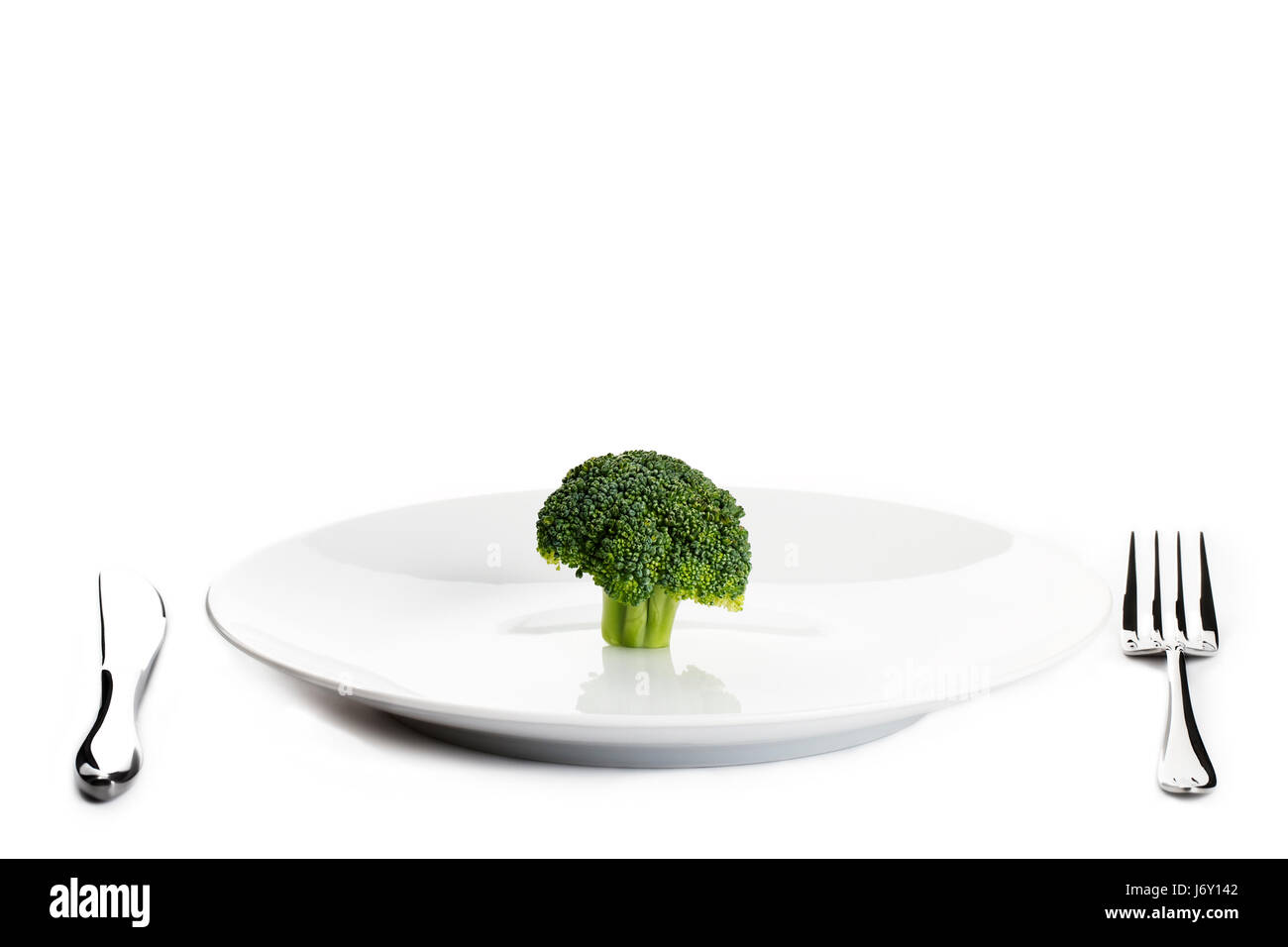 leere europäischen kaukasischen Teller grün Pflanzenkost Gabel Brokkoli Arm Waffe Stockfoto