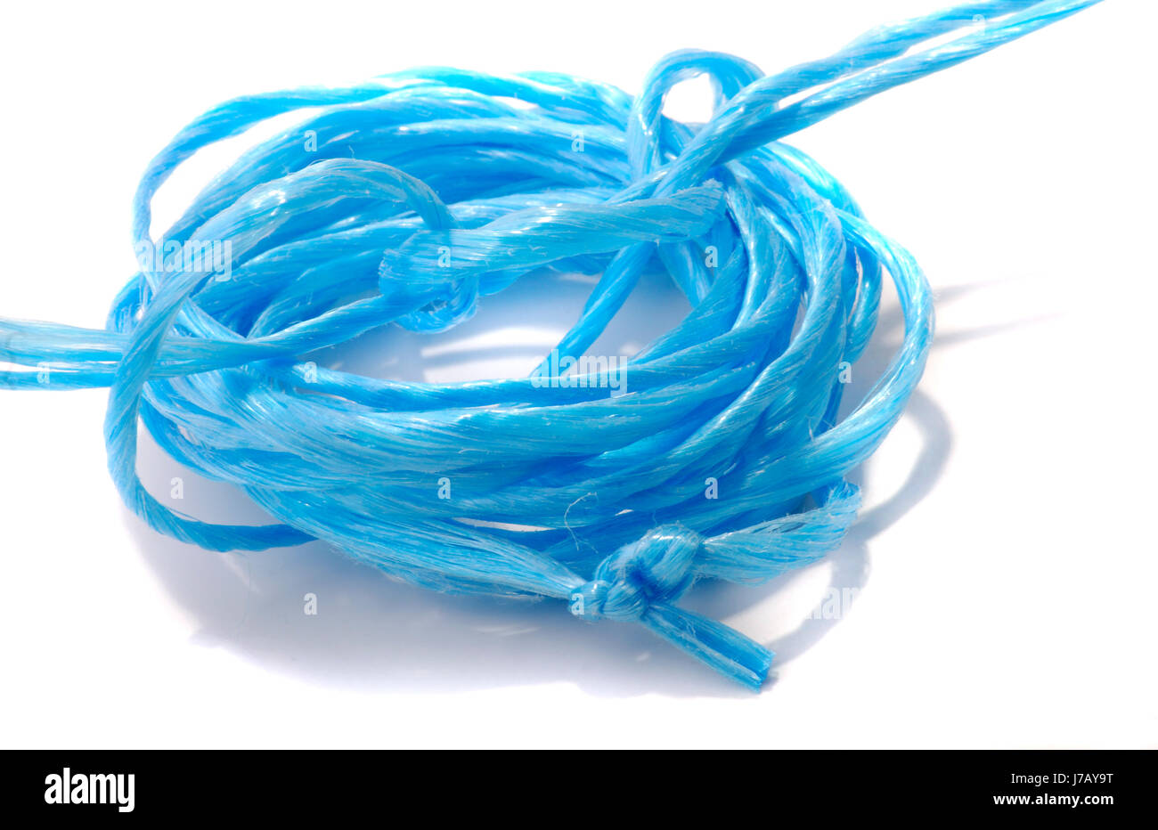 blaue Haushalt Tau Kordel abgerollten Seil Schnur String blau Makro Nahaufnahme Makro Stockfoto